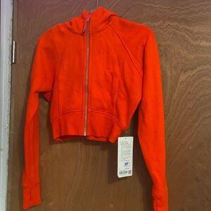 orange cropped lululemon scuba zip up size 6